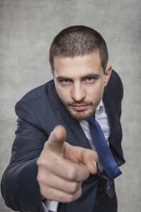 Young Businessman Pointing At You