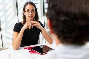 Businesswoman Interviewing Male Candidate For Job