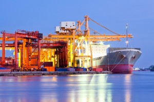 Industrial Container Cargo freight ship with working crane bridg