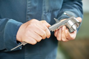 mechanical technician worker hands measuring detail tool after p