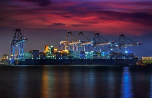 Container Cargo Freight Ship With Working Crane