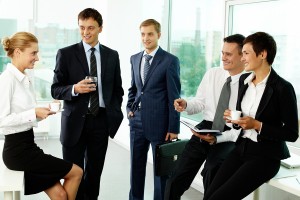Five business colleagues communicating at break