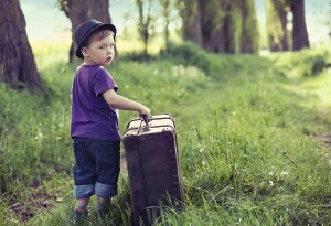 Little kid with big suitcase