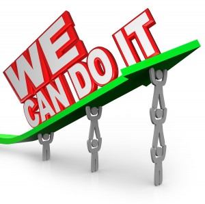 The words We Can Do It lifted on an arrow by a team of people or