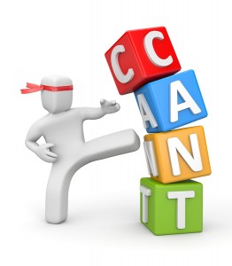 Person doing a kick of cubes pyramid with word can't